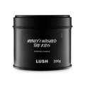 Honey I Washed The Kids. A round, black, candle tin with a removable lid. The black label on the front reads "Honey I Washed The Kids Scented Candle" in white text.