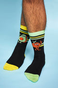 A shot of the model's calves down shows them standing on tip toes showing the Fresh Values socks.